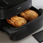 Philips Friggitrice ad Aria Capacità 7.1 Litri Potenza 2450 Watt Doppio Cestello Flessibile con Tecnologia Rapid Air colore Nero - NA150/00 Serie 1000