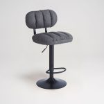 Sgabello Tati con seduta in ecopelle grigio e gamba in metallo nero